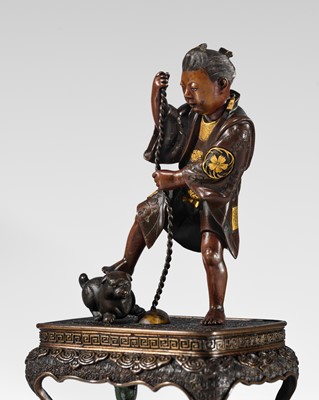 MIYAO: A FINE PARCEL-GILT BRONZE OKIMONO OF A BOY WITH A DOG