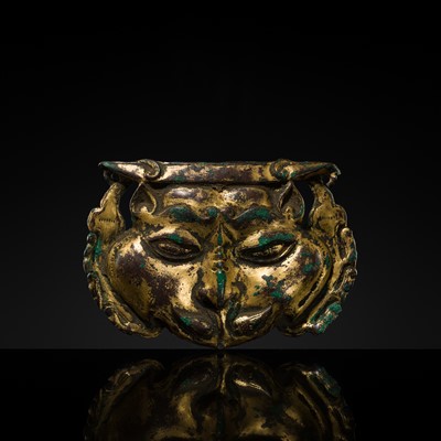 Lot 38 - A GILT-COPPER REPOUSSÉ SNOW LION MASK, TIBET, 17TH-18TH CENTURY
