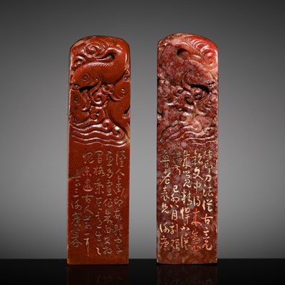 Lot 132 - A FINE PAIR OF ‘CHICKEN BLOOD’ SOAPSTONE SEALS BY HE TANG, DATED 1879