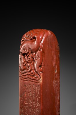 A FINE PAIR OF ‘CHICKEN BLOOD’ SOAPSTONE SEALS BY HE TANG, DATED 1879