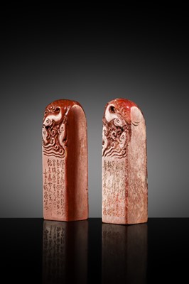 A FINE PAIR OF ‘CHICKEN BLOOD’ SOAPSTONE SEALS BY HE TANG, DATED 1879