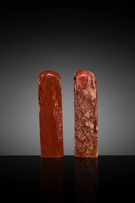 A FINE PAIR OF ‘CHICKEN BLOOD’ SOAPSTONE SEALS BY HE TANG, DATED 1879