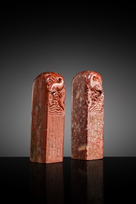 A FINE PAIR OF ‘CHICKEN BLOOD’ SOAPSTONE SEALS BY HE TANG, DATED 1879