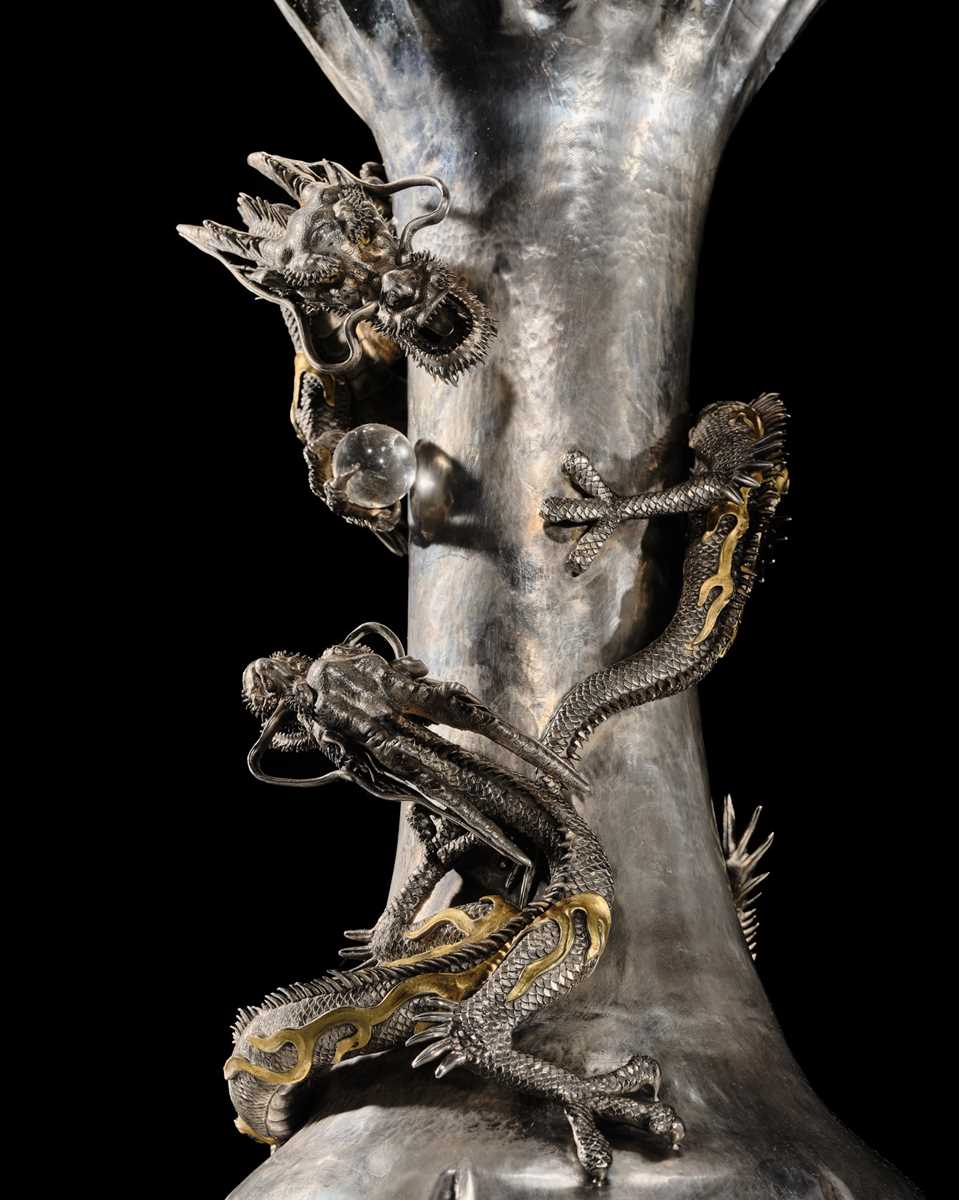 Lot 22 - WATANABE: AN IMPRESSIVE AND VERY LARGE (53 CM) SILVER ‘DRAGONS WITH CRYSTAL TAMA’ VASE