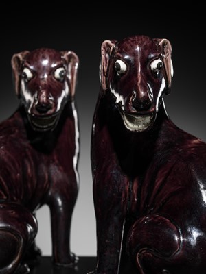 Lot 269 - A RARE PAIR OF AUBERGINE-GLAZED FIGURES OF HOUNDS, KANGXI PERIOD
