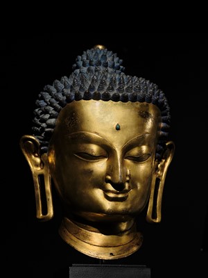 Lot 36 - THE MONUMENTAL AND UNIQUE ‘ULRICH VON SCHROEDER’ GILT-COPPER HEAD OF BUDDHA, TIBET, 14TH CENTURY