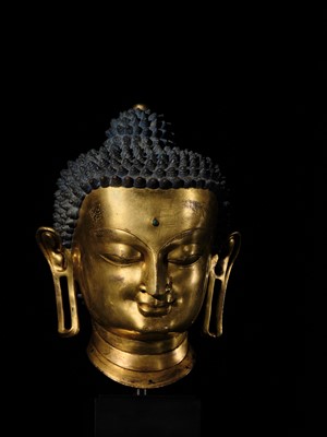 Lot 36 - THE MONUMENTAL AND UNIQUE ‘ULRICH VON SCHROEDER’ GILT-COPPER HEAD OF BUDDHA, TIBET, 14TH CENTURY