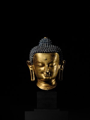 Lot 36 - THE MONUMENTAL AND UNIQUE ‘ULRICH VON SCHROEDER’ GILT-COPPER HEAD OF BUDDHA, TIBET, 14TH CENTURY