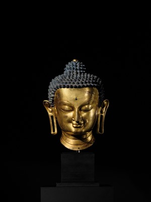 Lot 36 - THE MONUMENTAL AND UNIQUE ‘ULRICH VON SCHROEDER’ GILT-COPPER HEAD OF BUDDHA, TIBET, 14TH CENTURY