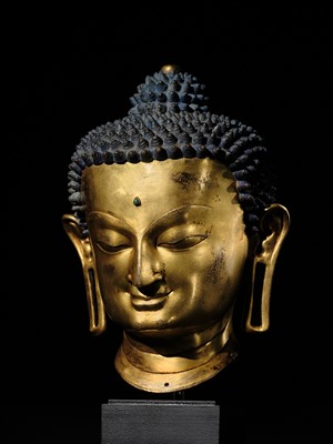 Lot 36 - THE MONUMENTAL AND UNIQUE ‘ULRICH VON SCHROEDER’ GILT-COPPER HEAD OF BUDDHA, TIBET, 14TH CENTURY