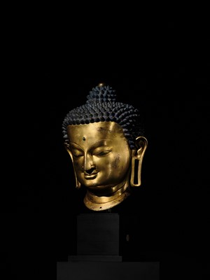 Lot 36 - THE MONUMENTAL AND UNIQUE ‘ULRICH VON SCHROEDER’ GILT-COPPER HEAD OF BUDDHA, TIBET, 14TH CENTURY