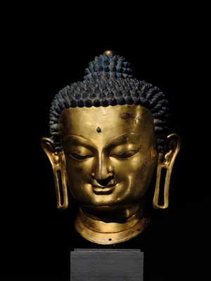Lot 36 - THE MONUMENTAL AND UNIQUE ‘ULRICH VON SCHROEDER’ GILT-COPPER HEAD OF BUDDHA, TIBET, 14TH CENTURY