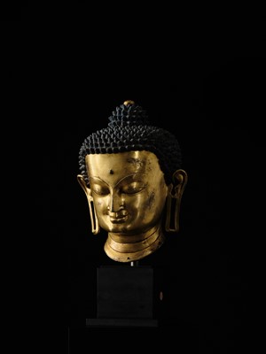 Lot 36 - THE MONUMENTAL AND UNIQUE ‘ULRICH VON SCHROEDER’ GILT-COPPER HEAD OF BUDDHA, TIBET, 14TH CENTURY