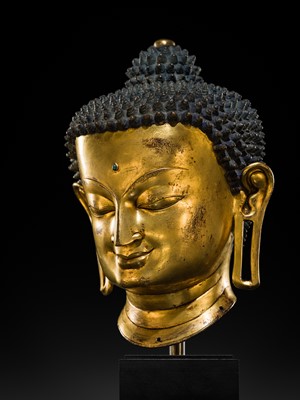Lot 36 - THE MONUMENTAL AND UNIQUE ‘ULRICH VON SCHROEDER’ GILT-COPPER HEAD OF BUDDHA, TIBET, 14TH CENTURY