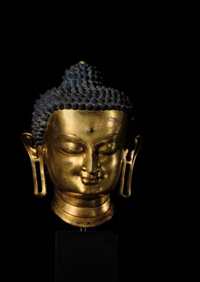 Lot 36 - THE MONUMENTAL AND UNIQUE ‘ULRICH VON SCHROEDER’ GILT-COPPER HEAD OF BUDDHA, TIBET, 14TH CENTURY