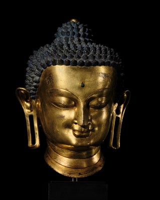 Lot 36 - THE MONUMENTAL AND UNIQUE ‘ULRICH VON SCHROEDER’ GILT-COPPER HEAD OF BUDDHA, TIBET, 14TH CENTURY