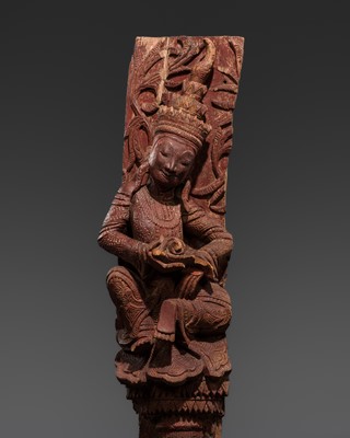 A LARGE RED-LACQUERED HARDWOOD ARCHITECTURAL FRAGMENT WITH A FEMALE DEITY