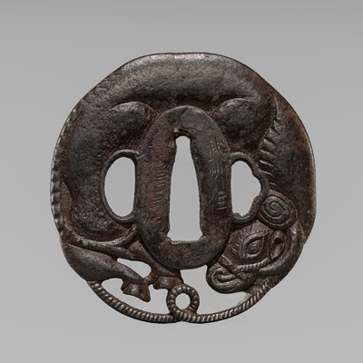 Lot 1163 - NOBUFUSA: A RARE IRON TSUBA OF A COILED OX