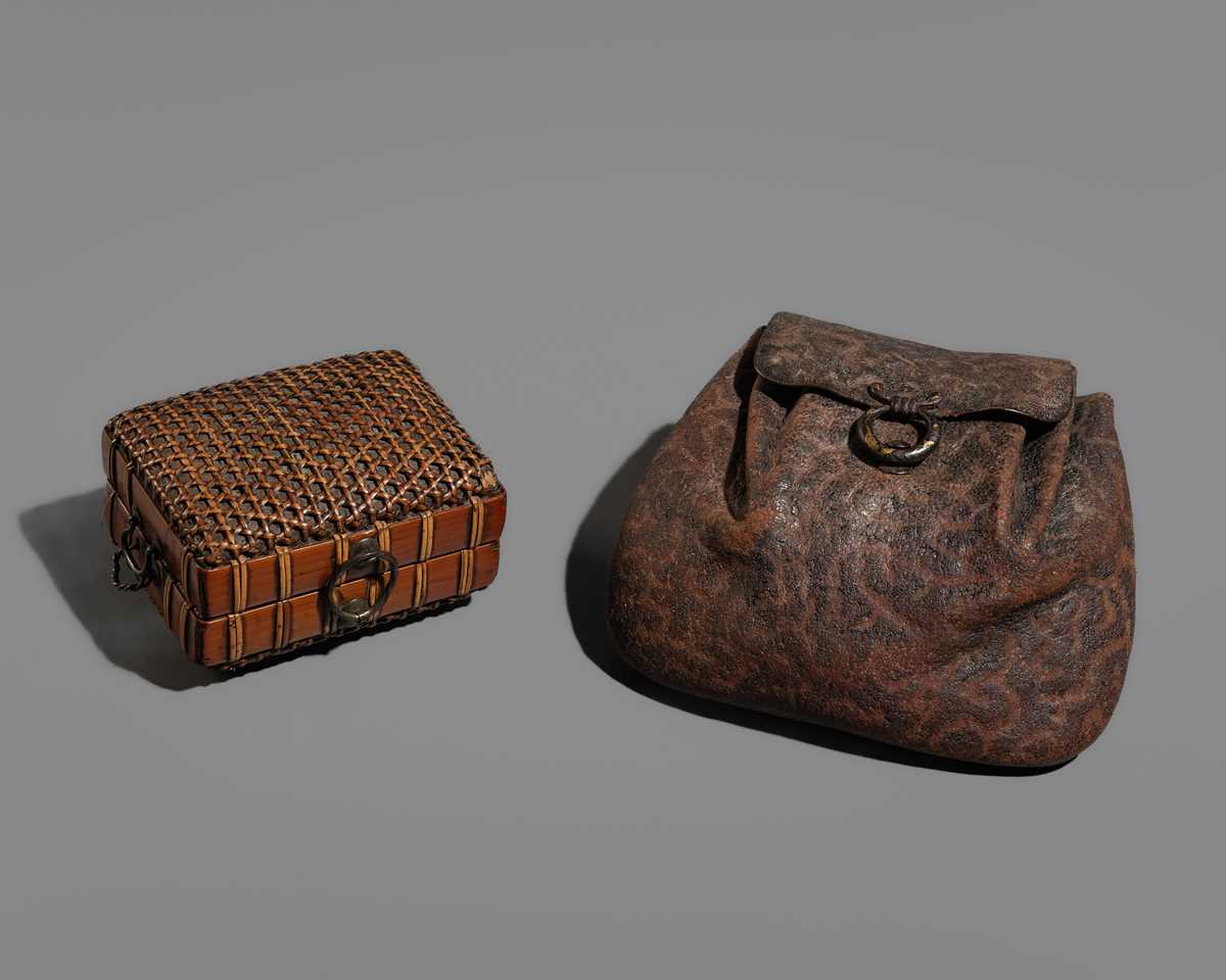 Lot 1559 - A GROUP OF TWO LEATHER AND RATTAN TABAKO-IRE (POUCHES)