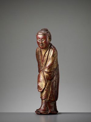 Lot 519 - A GILT AND LACQUERED WOOD FIGURE OF A BUDDHIST PRIEST, LATE MING