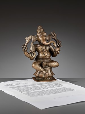 Lot 747 - AN INDIAN BRONZE FIGURE OF GANESHA, 17TH-18TH CENTURY