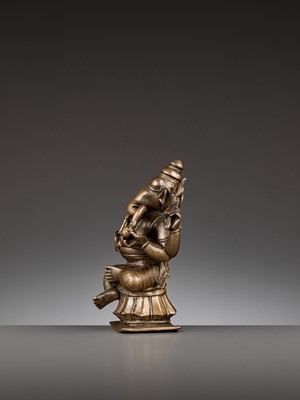 Lot 747 - AN INDIAN BRONZE FIGURE OF GANESHA, 17TH-18TH CENTURY
