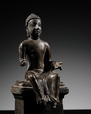 Lot 454 - A SILVERED COPPER ALLOY FIGURE OF THE ENTHRONED BUDDHA, MON-DVARAVATI, THAILAND, 8TH-9TH CENTURY