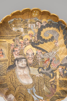 Lot 1572 - A SATSUMA EARTHENWARE SCALLOPED DISH WITH ARHATS