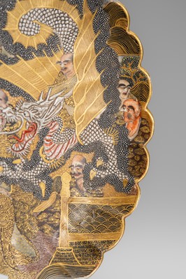 Lot 1572 - A SATSUMA EARTHENWARE SCALLOPED DISH WITH ARHATS