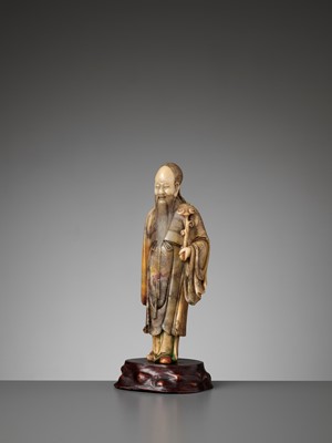 Lot 38 - A CARVED SOAPSTONE FIGURE OF SHOULAO, MID-QING