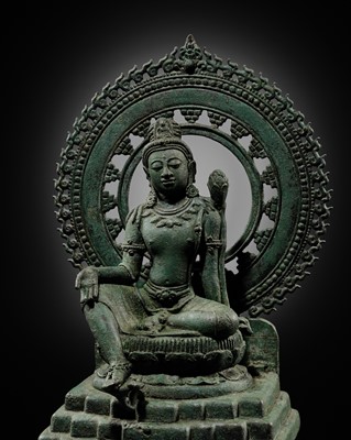 Lot 499 - A BRONZE FIGURE OF AVALOKITESHVARA PADMAPANI SEATED ON MOUNT POTALA, SRIVIJAYA EMPIRE, SUMATRA, 8TH-10TH CENTURY