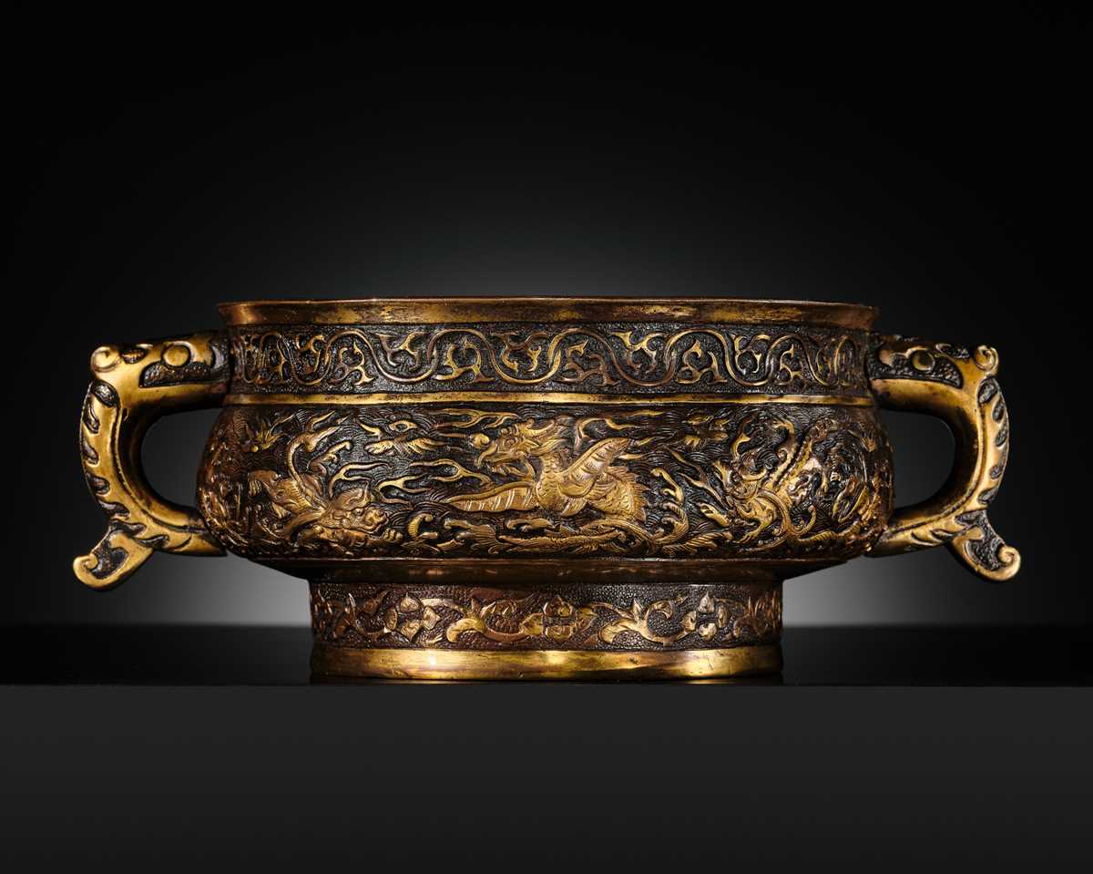 Lot 103 - A HU WENMING PARCEL-GILT BRONZE ‘TEN