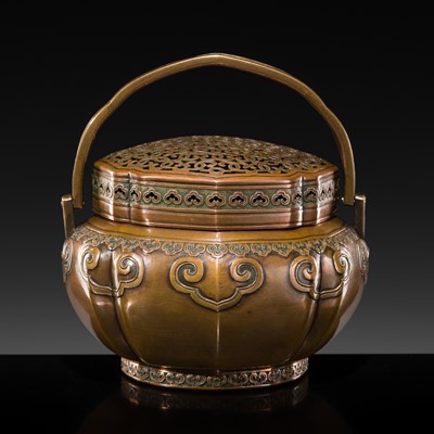 Lot 155 - A FINE COPPER ALLOY ‘RUYI’ HAND WARMER AND COVER, 18TH CENTURY