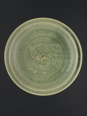 Lot 185 - A LONGQUAN CELADON CARVED ‘PEONY’ DISH, MING DYNASTY