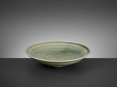 Lot 185 - A LONGQUAN CELADON CARVED ‘PEONY’ DISH, MING DYNASTY