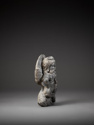 Lot 543 - A GRAY SCHIST FIGURE OF A WINGED ATLAS, GANDHARA