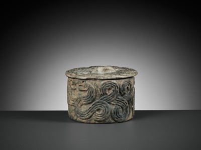 Lot 550 - A WESTERN ASIATIC CHLORITE ‘SNAKE AND LION’ JAR AND COVER, 3RD MILLENNIUM BC