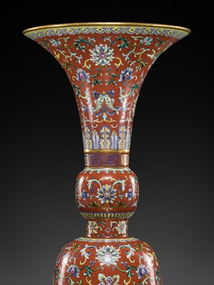 Lot 276 - A CORAL-RED-GROUND FAMILLE-ROSE ‘BAJIXIANG’ ALTAR VASE, GU, QIANLONG MARK AND PERIOD