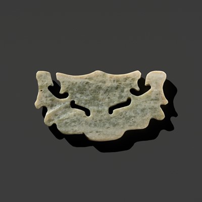 Lot 199 - A RARE PALE CELADON JADE ‘MASK’ PENDANT, LATE NEOLITHIC PERIOD, SHIJIAHE CULTURE