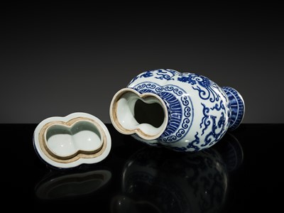 Lot 175 - AN IMPERIAL BLUE AND WHITE 'PHOENIX AND DRAGON' DOUBLE VASE AND COVER, QIANLONG MARK AND OF THE PERIOD