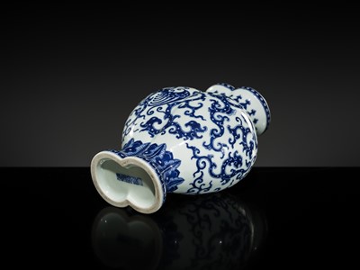 Lot 175 - AN IMPERIAL BLUE AND WHITE 'PHOENIX AND DRAGON' DOUBLE VASE AND COVER, QIANLONG MARK AND OF THE PERIOD
