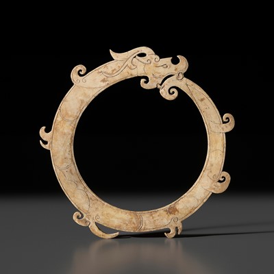 A RARE CREAM-WHITE JADE ‘DRAGON’ RING, LATE WESTERN HAN DYNASTY