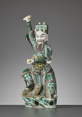 Lot 215 - A FAMILLE VERTE BISCUIT FIGURE OF CAISHEN IN WRATHFUL GUISE, KANGXI