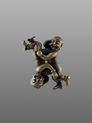 Lot 507 - A 'TWIN BOYS' BRONZE SCROLL WEIGHT, MING DYNASTY