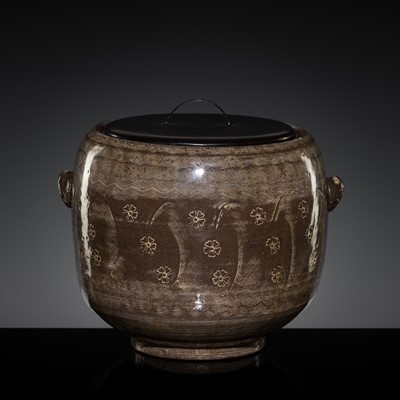 Lot 294 - A BROWN-GLAZED KARATSU WARE ‘PRUNUS’ FRESH WATER JAR (MIZUSASHI) AND COVER, LATE MOMOYAMA PERIOD