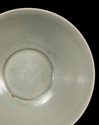 Lot 11 - A LONGQUAN CELADON CARVED ‘PEONY AND LOTUS’ BOWL, LATE SOUTHERN SONG-YUAN DYNASTY