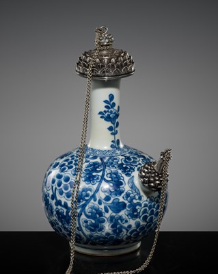 Lot 193 - A SILVER-MOUNTED BLUE AND WHITE PORCELAIN ‘LOTUS’ KENDI, QING DYNASTY, KANGXI PERIOD