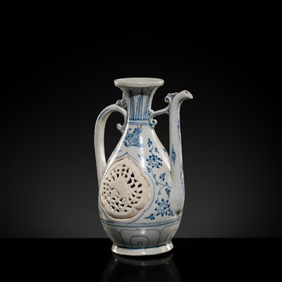 Lot 40 - A RETICULATED BLUE AND WHITE STONEWARE EWER, LÊ DYNASTY, LATE 15TH CENTURY, FROM THE HOI AN HOARD