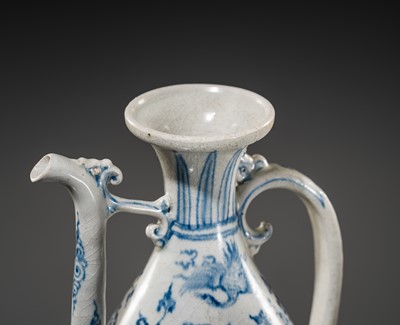 Lot 40 - A RETICULATED BLUE AND WHITE STONEWARE EWER, LÊ DYNASTY, LATE 15TH CENTURY, FROM THE HOI AN HOARD