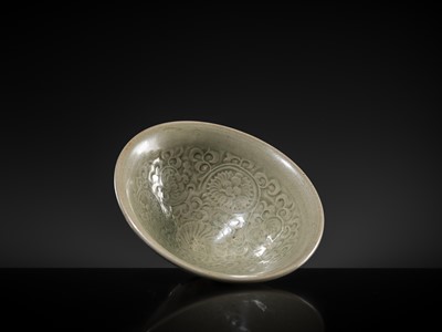 Lot 9 - A LARGE YAOZHOU CELADON-GLAZED ’CHRYSANTHEMUM’ BOWL, NORTHERN SONG-JIN DYNASTY